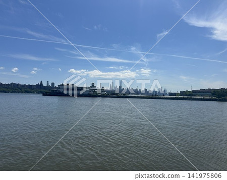 Manhattan skyline and blue sky viewed across the Hudson River Manhattan skyline and blue sky viewed across the Hudson River 141975806