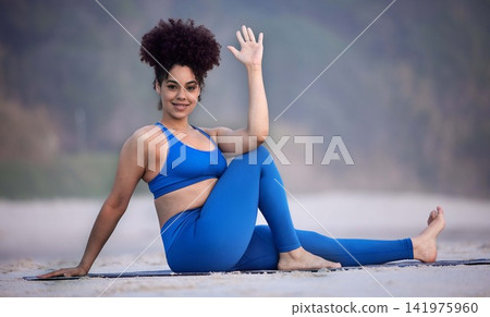 Portrait, yoga and happy woman at beach for exercise, fitness and healthy body outdoor in Brazil. Smile, girl and practice pilates in nature for wellness, balance or stretching to relax in summer 141975960
