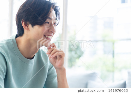 A young man with a cheerful smile A young man with a cheerful smile 141976033