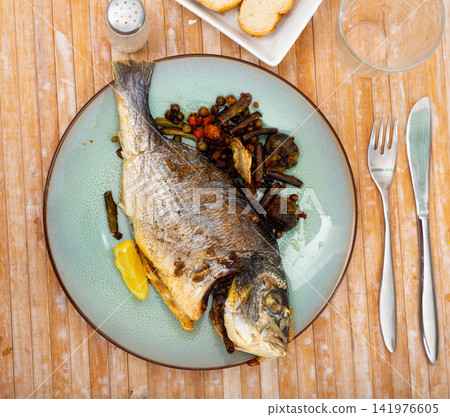 Grilled dorada with roasted Brussels sprouts, green beans, peas, chickpeas Grilled dorada with roasted Brussels sprouts, green beans, peas, chickpeas 141976605