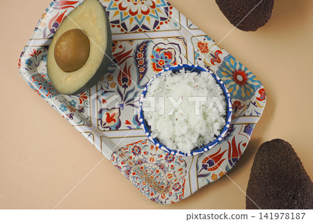 Avocado avocado scrub on a decorative plate Avocado avocado scrub on a decorative plate 141978187
