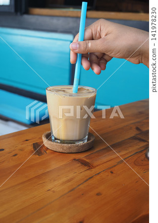 Coffee drink on a wooden table in a cafe 141978230