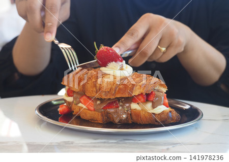 Croissant dessert preparation in a cafe during the day Croissant dessert preparation in a cafe during the day 141978236