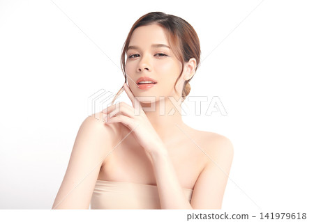 A beautiful young Asian woman with clean, fresh skin against a white background. Skincare, facial treatment, cosmetology, beauty, and spa. An elegant portrait of an Asian woman. A beautiful young Asian woman with clean, fresh skin against a white background. Skincare, facial treatment, cosmetology, beauty, and spa. An elegant portrait of an Asian woman. 141979618