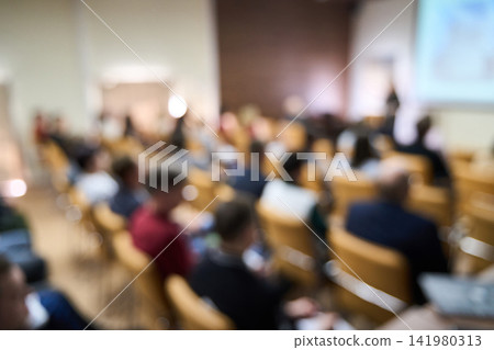 Audience Seated Listening Lecture Hall Conference Attendees In Auditorium During Corporate Seminar 141980313