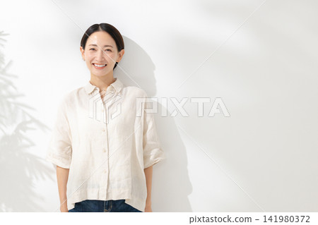 A smiling middle woman A smiling middle woman 141980372