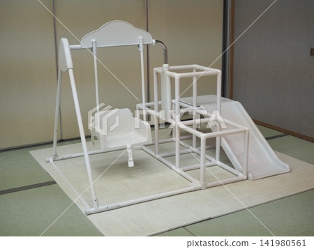 Multi-purpose indoor play equipment (swings, slides, jungle gym) 141980561