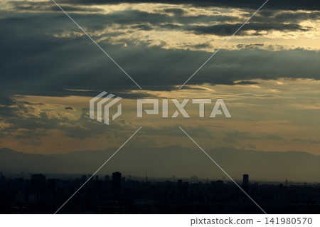 Jacob's Ladder, mountain ranges floating in the evening sky, and cityscapes. Jacob's Ladder, mountain ranges floating in the evening sky, and cityscapes. 141980570