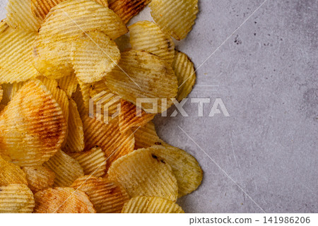 Crispy fresh potato chips, junk food Crispy fresh potato chips, junk food 141986206