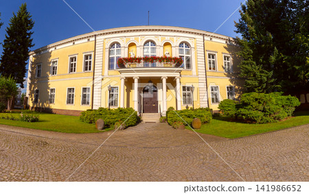 Historic Yellow Building and Garden on Ostrow Tumski in Poznan, Poland Historic Yellow Building and Garden on Ostrow Tumski in Poznan, Poland 141986652