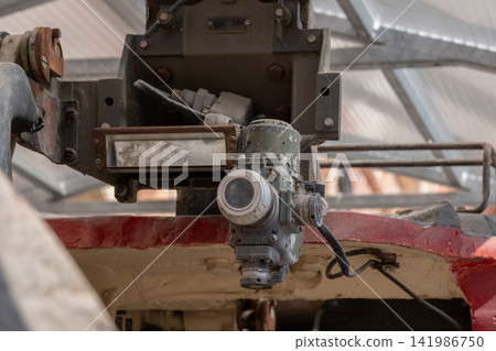 Close up of vintage industrial machine component inside metal workshop 141986750