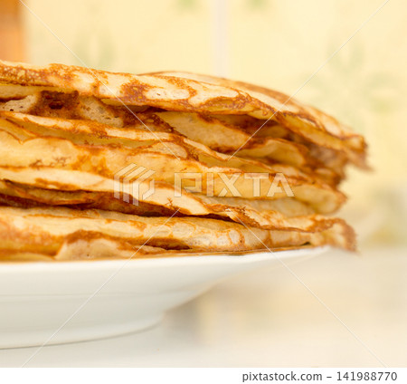 Pancakes lying on a plate. Pancakes lying on a plate. 141988770