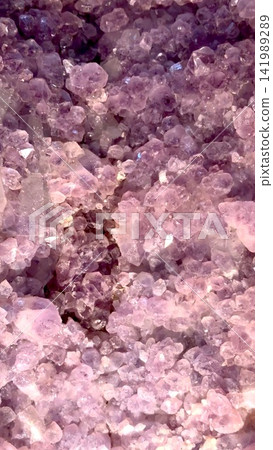 Purple amethyst crystal cluster with sparkling translucent facets, rough mineral matrix, and rich violet tones filling frame in detailed close view, with amethyst, crystal, cluster, purple detail Purple amethyst crystal cluster with sparkling translucent facets, rough mineral matrix, and rich violet tones filling frame in detailed close view, with amethyst, crystal, cluster, purple detail 141989289