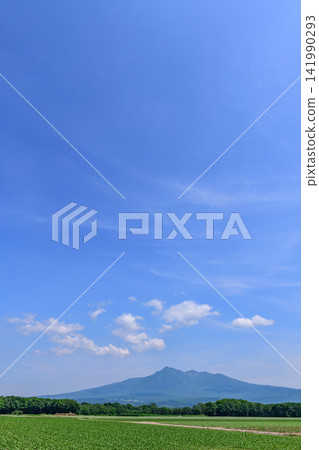Kiyosato in Eastern Hokkaido: A single road, potato fields, and Mount Shari. Kiyosato in Eastern Hokkaido: A single road, potato fields, and Mount Shari. 141990293
