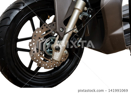 Front wheel of a modern scooter with disc brake and suspension system isolated on a white background. Front wheel of a modern scooter with disc brake and suspension system isolated on a white background. 141991069