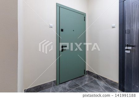 Apartment Entryway Interior with Green Entrance Door and Tiled Floor Apartment Entryway Interior with Green Entrance Door and Tiled Floor 141991188