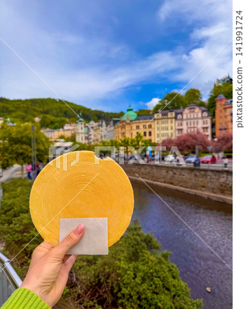 Enjoying a treat by the river in Karlovy Vary, Czechia Enjoying a treat by the river in Karlovy Vary, Czechia 141991724