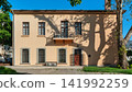 Side facade of the historic Ataturk House in Antalya, Turkey, with tree shadows cast on the building wall 141992259
