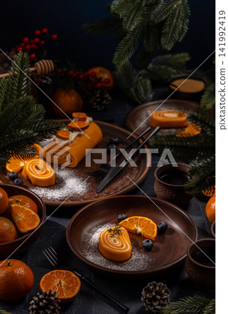 Tangerine swiss roll dessert for festive winter holiday Tangerine swiss roll dessert for festive winter holiday 141992419