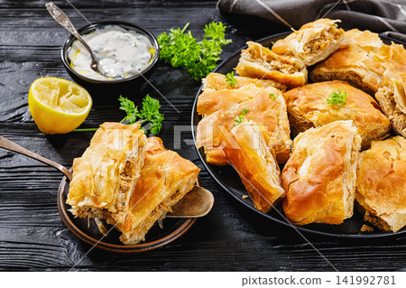 Greek kreatopita of phyllo filled with minced meat Greek kreatopita of phyllo filled with minced meat 141992781