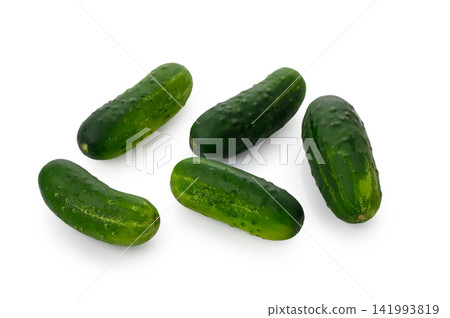 Fresh green cucumbers arranged together isolated on white background Fresh green cucumbers arranged together isolated on white background 141993819