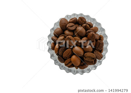 Overhead Shot of Roasted Coffee Beans in a Scalloped Glass Bowl Overhead Shot of Roasted Coffee Beans in a Scalloped Glass Bowl 141994279