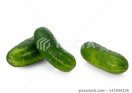 Fresh green cucumbers arranged together isolated on white background Fresh green cucumbers arranged together isolated on white background 141994326