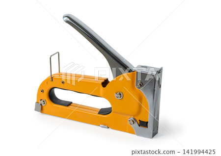 Bright orange stapler shines on a clean white surface, ready for action in a creative workspace filled with craft supplies and papers Bright orange stapler shines on a clean white surface, ready for action in a creative workspace filled with craft supplies and papers 141994425