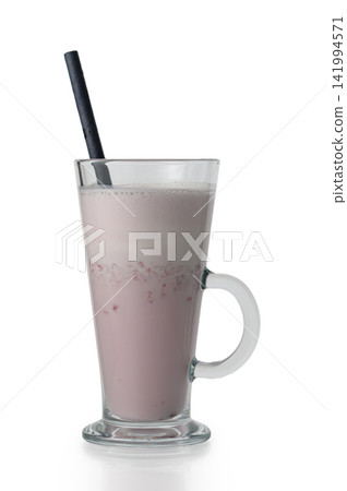 Glass of strawberry milkshake with a straw on a white background Glass of strawberry milkshake with a straw on a white background 141994571