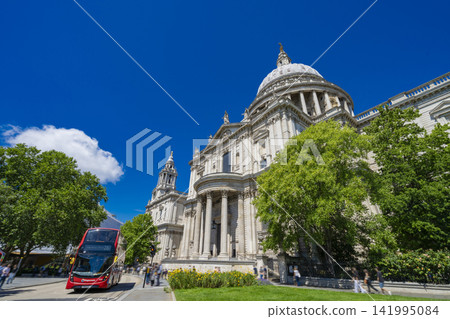 St. Paul's Cathedral and the surrounding cityscape in London, standing against a blue sky. St. Paul's Cathedral and the surrounding cityscape in London, standing against a blue sky. 141995084