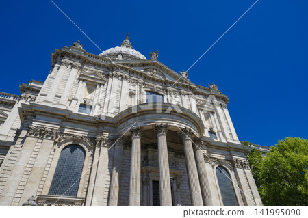 St. Paul's Cathedral and the surrounding cityscape in London, standing against a blue sky. St. Paul's Cathedral and the surrounding cityscape in London, standing against a blue sky. 141995090