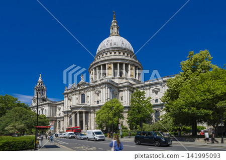 St. Paul's Cathedral and the surrounding cityscape in London, standing against a blue sky. St. Paul's Cathedral and the surrounding cityscape in London, standing against a blue sky. 141995093