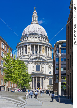 St. Paul's Cathedral and the surrounding cityscape in London, standing against a blue sky. St. Paul's Cathedral and the surrounding cityscape in London, standing against a blue sky. 141995094