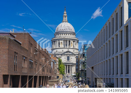 St. Paul's Cathedral and the surrounding cityscape in London, standing against a blue sky. St. Paul's Cathedral and the surrounding cityscape in London, standing against a blue sky. 141995095