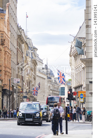 The streets of London with the Union Jack fluttering in the wind. The streets of London with the Union Jack fluttering in the wind. 141995141