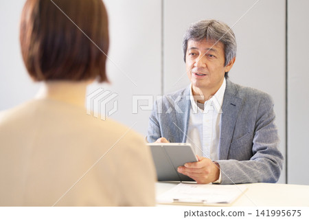 Senior male staff conducting interviews. Senior male staff conducting interviews. 141995675