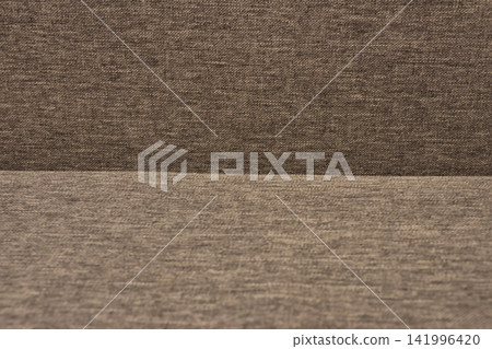 Textured gray fabric upholstery background with subtle variations in color and weave pattern, ideal for interior design and textile applications Textured gray fabric upholstery background with subtle variations in color and weave pattern, ideal for interior design and textile applications 141996420