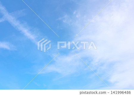 Serene Blue Sky with Wispy White Clouds - Ideal for Calm and Tranquility Themes Serene Blue Sky with Wispy White Clouds - Ideal for Calm and Tranquility Themes 141996486
