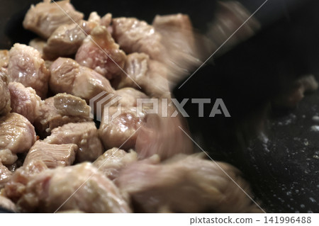 Cooking Tender Pork Pieces in a Pan - Culinary Preparation for Savory Dishes Cooking Tender Pork Pieces in a Pan - Culinary Preparation for Savory Dishes 141996488