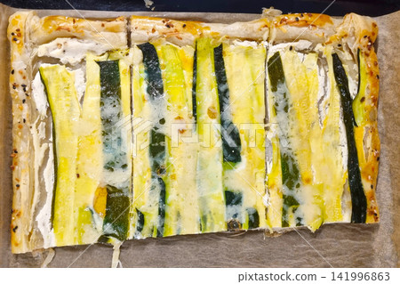 Gourmet Zucchini Tart with Creamy Cheese and Flaky Pastry Perfect for Summer Entertaining Gourmet Zucchini Tart with Creamy Cheese and Flaky Pastry Perfect for Summer Entertaining 141996863