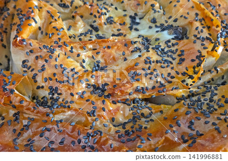 Golden, Crispy Pastry with Black Sesame Seeds Topping for Culinary Delights Golden, Crispy Pastry with Black Sesame Seeds Topping for Culinary Delights 141996881