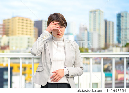 Businesswoman complains of feeling unwell 141997264