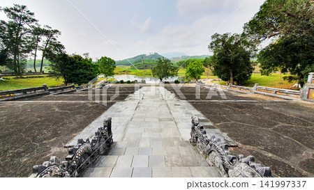 Landscape Of Courtyard And Mountain In Font Of Mausoleum Of King Gia Long (Also Called Thien Tho Mausoleum) In Hue, Vietnam. Landscape Of Courtyard And Mountain In Font Of Mausoleum Of King Gia Long (Also Called Thien Tho Mausoleum) In Hue, Vietnam. 141997337