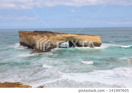 Natural Rock Arch Formation with Crashing Waves on Australian Coast Natural Rock Arch Formation with Crashing Waves on Australian Coast 141997605
