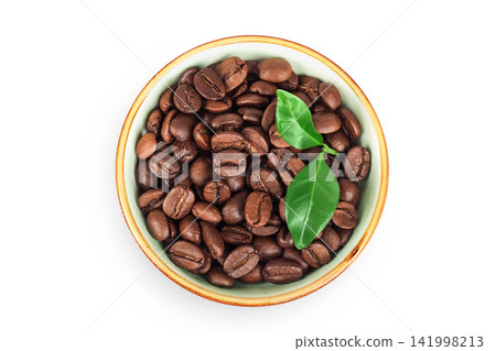 Coffee beans in ceramic bowl isolated on a white background. Top view Coffee beans in ceramic bowl isolated on a white background. Top view 141998213