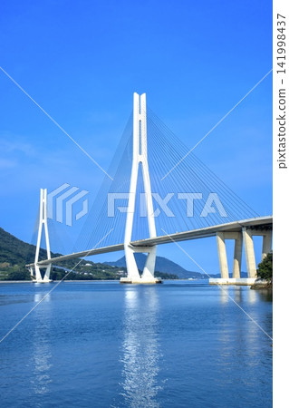 Tatara Bridge as seen from Omishima Island on the Shimanami Kaido. Tatara Bridge as seen from Omishima Island on the Shimanami Kaido. 141998437