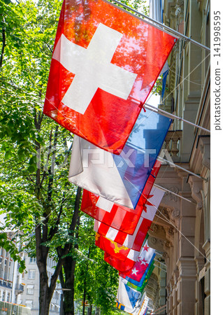 Red and White Swiss Flags Hanging in Switzerland Red and White Swiss Flags Hanging in Switzerland 141998595