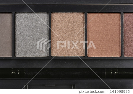Eyeshadow palette close up with neutral shades Eyeshadow palette close up with neutral shades 141998955