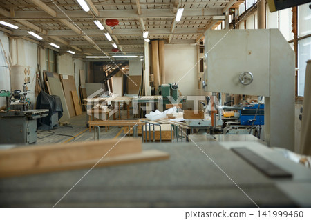 Abandoned carpentry space with equipment. Laboratory of woodcraft with manufacturing apparatus Abandoned carpentry space with equipment. Laboratory of woodcraft with manufacturing apparatus 141999460