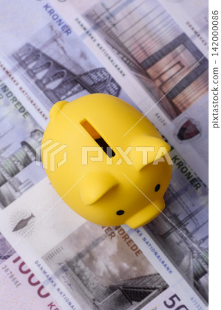 A piggy bank as a concept for storing, accumulating, and saving financial resources. A piggy bank A piggy bank as a concept for storing, accumulating, and saving financial resources. A piggy bank 142000086